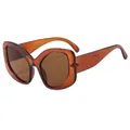 Elegant cat-eye sunglasses with translucent amber frames and matching brown lenses - Clear Tea Frame Tea Lens