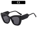 Eleganti occhiali da sole cat-eye con montatura nera spessa e lenti scure - Montatura Nera Lenti Grigie