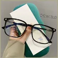 Classic glossy black TR90 anti-blue light glasses with retro gold temple details - Bright Black
