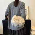Beige faux fur crossbody bag with golden pearl chain strap shown on a model's shoulder - 22*10*14 / Khaki