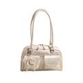 Cream patent leather shoulder bag with front double pockets and pearl bow charm accessory - Off White