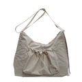 Minimalist beige nylon crossbody bag featuring a unique drawstring pocket and adjustable strap - Off-white