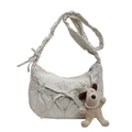 Minimalist cream white crossbody bag with stylish pleats and a cute puppy pendant - Off White
