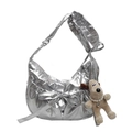 Metallic silver puffy crossbody bag with a large bow detail and plush puppy charm - Silver