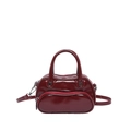 Dark red patent leather crossbody bag with rounded design and silver hardware - Red