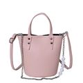 Pink bucket bag with lychee texture featuring a pearl chain and adjustable shoulder strap - Pink