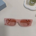 Pink rectangular fashion sunglasses with translucent frames and V-shaped metal accent - Pink