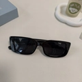 Square black frame fashion sunglasses with UV400 lenses on minimalist desktop - Black