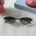 Lunettes de soleil œil de chat sans monture avec verres dégradés et branches dorées - Vert