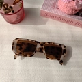 Detail shot of chunky tortoise pattern sunglasses with retro square frame and brown lenses - Milk Cow Pattern