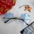 Close-up of light blue snowflake shaped rimless sunglasses with gold metal bridge and festive decor - Blue Snowflake