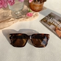 Detail shot of vintage square brown tortoiseshell sunglasses with gold metal accents - Tortoise Shell