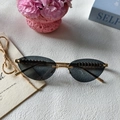 Lunettes de soleil œil de chat sans monture rétro avec verres gris et branches en métal doré - Tout Gris