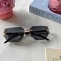 Rimless geometric sunglasses with grey lenses and gold C-shaped metal hardware - Full Grey