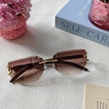 Frameless geometric sunglasses with brown gradient lenses and gold C-shaped metal hinges - Double Tea