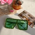 Oversized square sunglasses featuring green transparent lenses and rhinestone-encrusted frames - Green