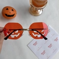 Orange pumpkin shaped rimless sunglasses with cut-out design for Halloween party - Large Pumpkin Red