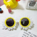 Children sunflower sunglasses with white petals, yellow core and dark round lenses - White