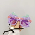 Detail of lavender cupcake shaped party sunglasses with colorful sprinkles for kids - Purple