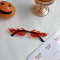 Frameless flame shaped sunglasses with orange lenses and black temples for party costumes - Flame Red