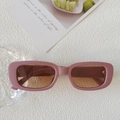 Pink rectangular matte sunglasses with tea gradient lenses on a white textured background - Sand Purple