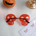 Frameless skull shaped party glasses with orange lenses and golden metal bridge - Skull Red
