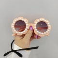 Détail de lunettes de soleil fleurs roses pour enfants avec perles et verres dégradés - Perle Orange