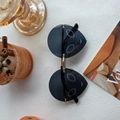 Unique black rimless cat-ear sunglasses with gold metal bridge and artistic hollow lens - Black Alien Rainbow Lens