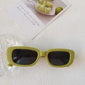 Retro avocado green rectangular sunglasses with dark lenses on a textured white surface - Sand Green