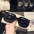 Detailed view of trendy oversized black square sunglasses with smoke lenses and thick frames - Black Frame Black Leg