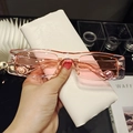 Detail of pink transparent rectangular sunglasses with a beige textured leather case - Transparent Pink