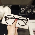 Classic black full-frame sunglasses with gold cross metal hinges and white leather case - Black Frame Clear Lenses