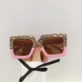 Stylish square kids sunglasses featuring leopard print and pink color-block frame - Leopard Top Dark Pink Bottom