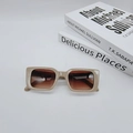 Close-up of retro rectangular sunglasses with beige frames and brown gradient lenses - Khaki