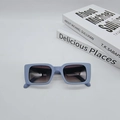 Close-up of light blue rectangular sunglasses with matte frame and gradient lenses - Blue