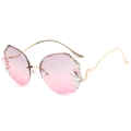Modieuze randloze zonnebril met roze verloopglazen en sprankelende diamantaccenten - Gouden Frame Grijs Roze Lenzen