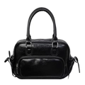Retro black glossy pleated backpack for women featuring silver hardware and side bow details - Black