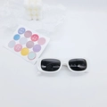 Close-up of white rectangular vintage kids sunglasses with dark lenses on a white background - White