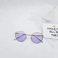 Detail of vintage round metal sunglasses with purple lenses and light gold frames - Purple
