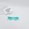 Detail shot of mint green cat-eye kids sunglasses on a clean aesthetic background - Blue