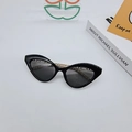 Fashionable black cat eye sunglasses with gold chain bridge and dark grey lenses - Bright Black