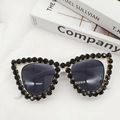 Detail view of white cat-eye sunglasses with hand-set black crystals on high-end frame - Silver Mirrored