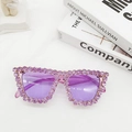 Detail of purple oversized sunglasses with hand-set rhinestones on a luxury background - Amethyst
