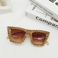 Detail of luxury cat-eye sunglasses with gradient brown lenses and sparkling crystals - Champagne
