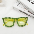 Detail of cat-eye sunglasses with green rhinestones and translucent yellow lenses - Neon Yellow