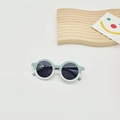 Close-up of lightweight round kids sunglasses in mint green and transparent white - Blue & White