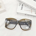Detailed view of olive green oversized square sunglasses frame with temple specifications - Transparent Green
