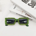 Detailed view of green translucent sunglasses frames with sparkling rhinestones decoration - Transparent Green