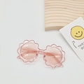 Detail of pink flower-shaped sunglasses for kids with transparent frames and UV lenses - Transparent Pink