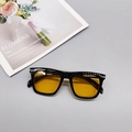 Detail shot of vintage square sunglasses with yellow lenses and silver metal temple accents - Black Frame Yellow Lens